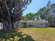 Charming single-story home with mature landscaping, including a large tree in the front yard at 2204 34Th W St, Bradenton, FL 34205