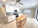 Bright kitchen featuring white cabinets, stainless steel appliances, and a stylish backsplash at 2204 34Th W St, Bradenton, FL 34205
