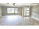 Spacious living room with tile flooring, ample natural light, and modern ceiling fan at 2204 34Th W St, Bradenton, FL 34205