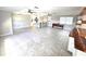 Bright and open living area with tile floors, a kitchen island and view of the Kitchen at 2204 34Th W St, Bradenton, FL 34205