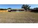 View of the home's backyard, featuring ample space and a well-maintained lawn at 2231 Lockwood Meadows Way, Sarasota, FL 34234