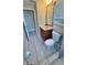 Bathroom featuring a vanity with a marble countertop, toilet and white tile floors at 2231 Lockwood Meadows Way, Sarasota, FL 34234