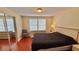 Comfortable bedroom features natural light, a mirrored closet, and clean, well maintained furnishings at 2231 Lockwood Meadows Way, Sarasota, FL 34234