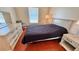 Bedroom featuring a queen bed, two nightstands, and a window; a tranquil retreat at 2231 Lockwood Meadows Way, Sarasota, FL 34234