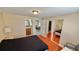 Bright bedroom with wood floors, access to bathroom and dining area, and a large mirrored closet at 2231 Lockwood Meadows Way, Sarasota, FL 34234