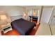 Bedroom featuring a queen bed, mirrored closet doors and a dresser; a tranquil retreat at 2231 Lockwood Meadows Way, Sarasota, FL 34234