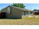 The side view of the home's backyard features a fence and a large air conditioning unit at 2231 Lockwood Meadows Way, Sarasota, FL 34234