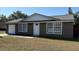 Charming exterior of home with attached garage and well-maintained yard at 2231 Lockwood Meadows Way, Sarasota, FL 34234