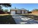 Charming exterior of home with attached garage and well-maintained yard at 2231 Lockwood Meadows Way, Sarasota, FL 34234