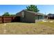 The side view of the home's backyard features a fence and a large air conditioning unit at 2231 Lockwood Meadows Way, Sarasota, FL 34234