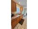 Kitchen area features granite countertops, modern sink and faucet, and tile flooring at 2231 Lockwood Meadows Way, Sarasota, FL 34234