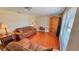 Cozy living room with wood floors, natural light, and stylish furniture at 2231 Lockwood Meadows Way, Sarasota, FL 34234