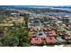 Scenic aerial view of community homes near a lake, showing convenient location at 2259 Pueblo Ln # V38, Sarasota, FL 34231