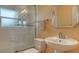 Bright bathroom featuring a glass-enclosed shower, toilet, and pedestal sink with a silver faucet at 2259 Pueblo Ln # V38, Sarasota, FL 34231