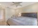 Comfortable bedroom featuring a ceiling fan, a cozy chair, and a queen-size bed at 2259 Pueblo Ln # V38, Sarasota, FL 34231