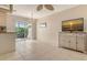 Dining room with tile flooring, a chandelier, a TV, and sliding glass doors to the patio at 2259 Pueblo Ln # V38, Sarasota, FL 34231