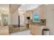 Kitchen with stainless appliances, granite counters, light wood cabinets and tile flooring at 2259 Pueblo Ln # V38, Sarasota, FL 34231