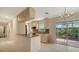 Kitchen with granite countertops, a center island, light wood cabinets, and tile flooring at 2259 Pueblo Ln # V38, Sarasota, FL 34231