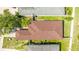 Overhead view of a single-story home highlighting the roof and landscaping at 2344 28Th E Ave, Palmetto, FL 34221