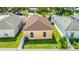 Backyard view showing the home's roof, and green lawn enclosed by a white fence at 2344 28Th E Ave, Palmetto, FL 34221