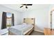 Bedroom features a window view, ceiling fan, and wood-look flooring at 2344 28Th E Ave, Palmetto, FL 34221