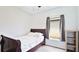 Relaxing bedroom with wood-look floors, neutral walls, and a wood-framed bed at 2344 28Th E Ave, Palmetto, FL 34221