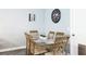 Dining area features a unique table with seating for six at 2344 28Th E Ave, Palmetto, FL 34221