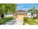 Beautiful single-story home with a well-manicured lawn and a two car garage at 2344 28Th E Ave, Palmetto, FL 34221