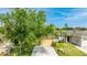 Attractive single-story home with a two car garage, green lawn, and mature trees at 2344 28Th E Ave, Palmetto, FL 34221