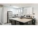 Well-equipped kitchen with stainless steel appliances and a center island with bar seating at 2344 28Th E Ave, Palmetto, FL 34221