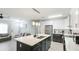 Open concept kitchen with stainless steel appliances and island at 2344 28Th E Ave, Palmetto, FL 34221