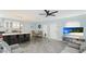 Open-concept living space with modern furnishings, including a dining area, kitchen and tv at 2344 28Th E Ave, Palmetto, FL 34221