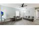 Bright living room with two gray sofas and gray wood flooring at 2344 28Th E Ave, Palmetto, FL 34221