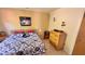 Cozy bedroom with queen bed, matching nightstands and dressers and a ceiling fan at 2448 45Th S St, St Petersburg, FL 33711