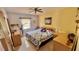 Warm bedroom featuring a queen size bed, natural light, and a ceiling fan at 2448 45Th S St, St Petersburg, FL 33711