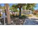 Charming home showcasing established landscaping, mature trees, and a well-maintained exterior at 2448 45Th S St, St Petersburg, FL 33711
