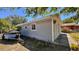 This home's features gray siding, an easy access door, and a trailer parked on the side at 2448 45Th S St, St Petersburg, FL 33711