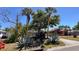 View of the home from the street, highlighting the established landscaping and adjacent homes at 2448 45Th S St, St Petersburg, FL 33711