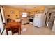 Bright eat-in kitchen with a wooden dining table and chairs and white appliances at 2448 45Th S St, St Petersburg, FL 33711