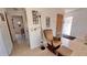 Cozy corner featuring a chair and ottoman, accent lighting, and tiled floors at 2448 45Th S St, St Petersburg, FL 33711