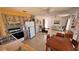Open concept living and kitchen features tiled floors, ceiling fans, and kitchen view at 2448 45Th S St, St Petersburg, FL 33711