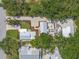 Aerial shot of a charming home, showcasing its landscaped yard, multiple patios, and outdoor living spaces at 2537 Ashton Rd, Sarasota, FL 34231