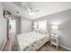 Cozy bedroom with neutral colors, ceiling fan, and ample natural light at 2537 Ashton Rd, Sarasota, FL 34231