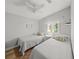 Comfortable bedroom with twin beds, ceiling fan, and natural light at 2537 Ashton Rd, Sarasota, FL 34231
