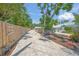 Long brick driveway leads to a charming home, surrounded by mature trees and landscaping at 2537 Ashton Rd, Sarasota, FL 34231