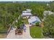 Charming single-story home with a well-manicured lawn, a brick driveway, and a welcoming front entrance at 2537 Ashton Rd, Sarasota, FL 34231