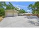 Spacious garage with ample parking and a large driveway, providing plenty of room for vehicles at 2537 Ashton Rd, Sarasota, FL 34231