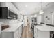 Contemporary kitchen with marble countertops, stainless steel appliances, and ample cabinet space at 2537 Ashton Rd, Sarasota, FL 34231
