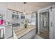 Modern kitchen features an island, stainless steel appliances, and white cabinetry at 2537 Ashton Rd, Sarasota, FL 34231