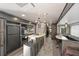 Stylish kitchen featuring an island, modern appliances, and an adjacent dining area with natural light at 2537 Ashton Rd, Sarasota, FL 34231